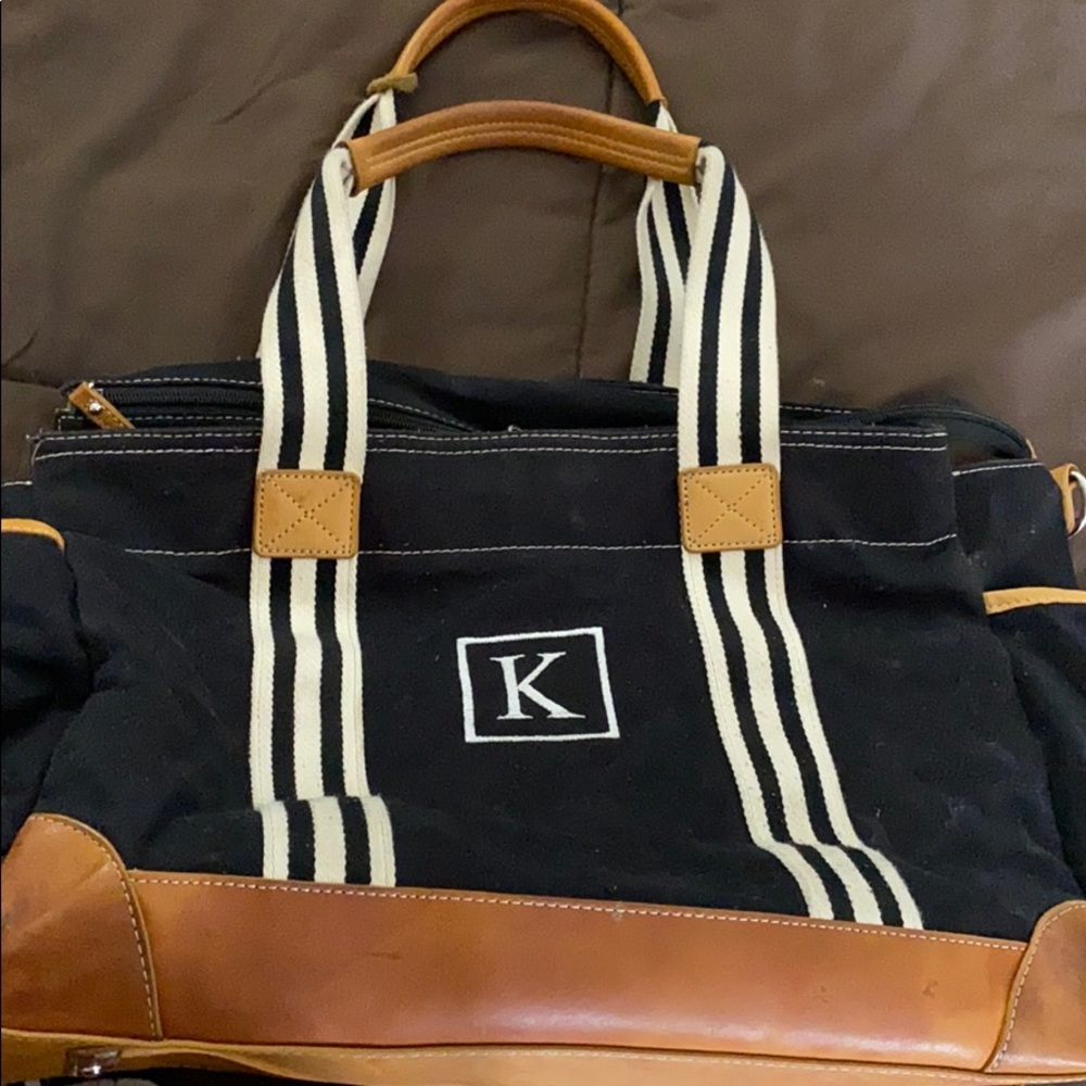 Pottotery barn baby diaper with an K  initial